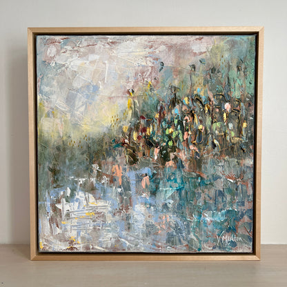 Abstract painting in a wooden frame on a wall