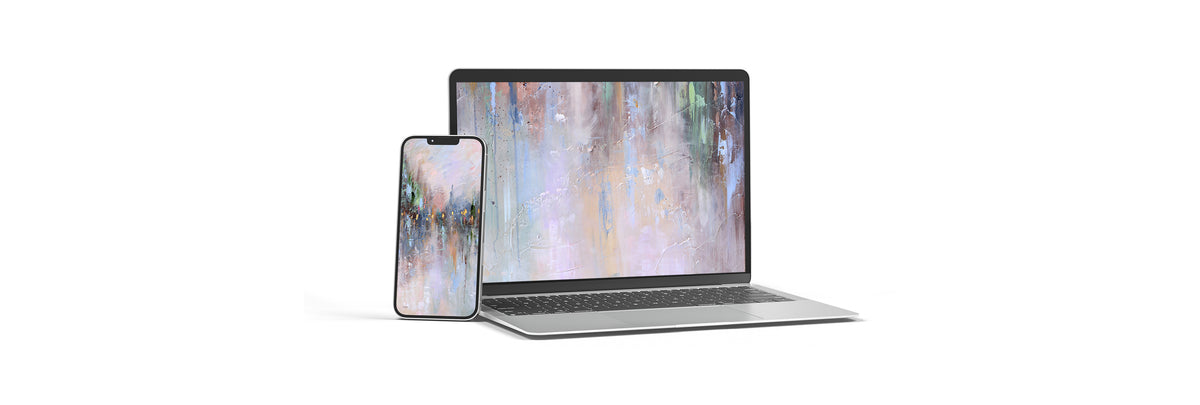 A silver laptop and matching smartphone standing side by side on a white background, both displaying an abstract multicolor screen image.